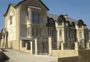 Особенности отделки фасада каменной плиткой